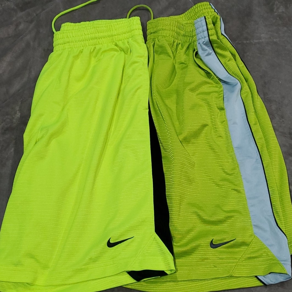 2 pairs of yellow Nike basketball shorts
